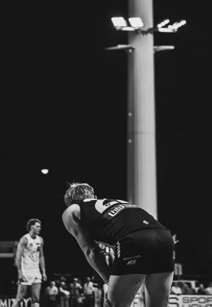 AFL player resetting after contest