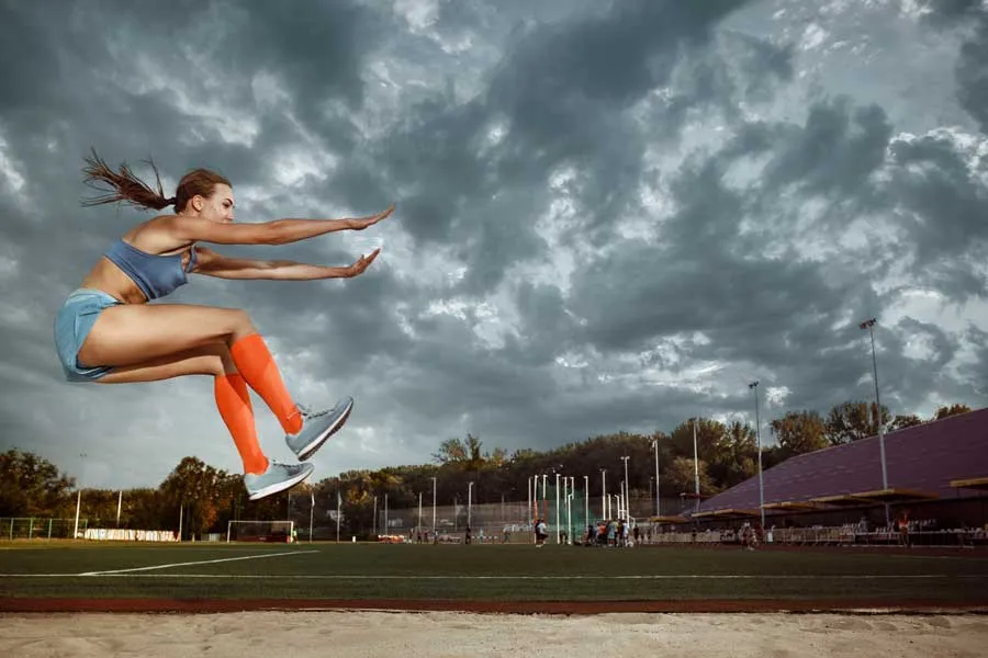 Athlete performing a long jump