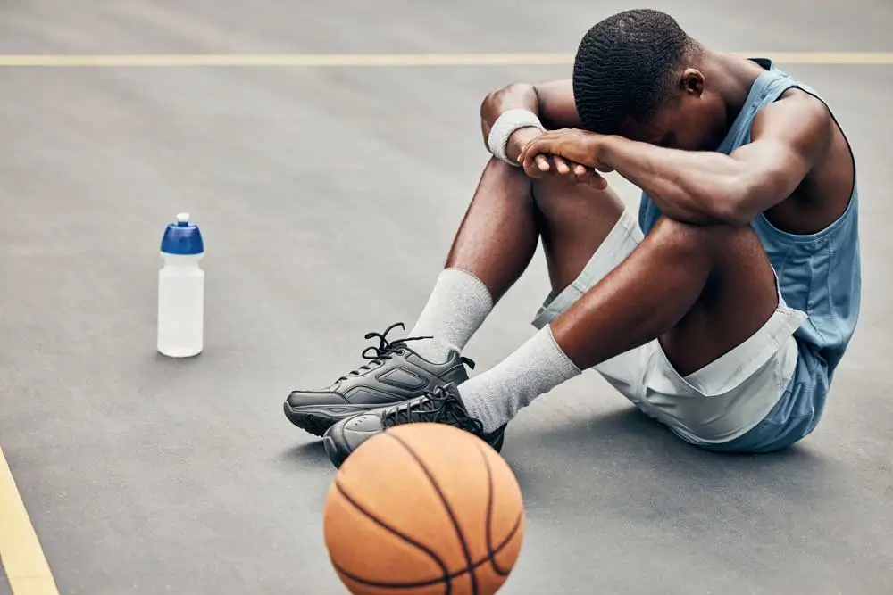 tired depression or sad basketball player with trophy