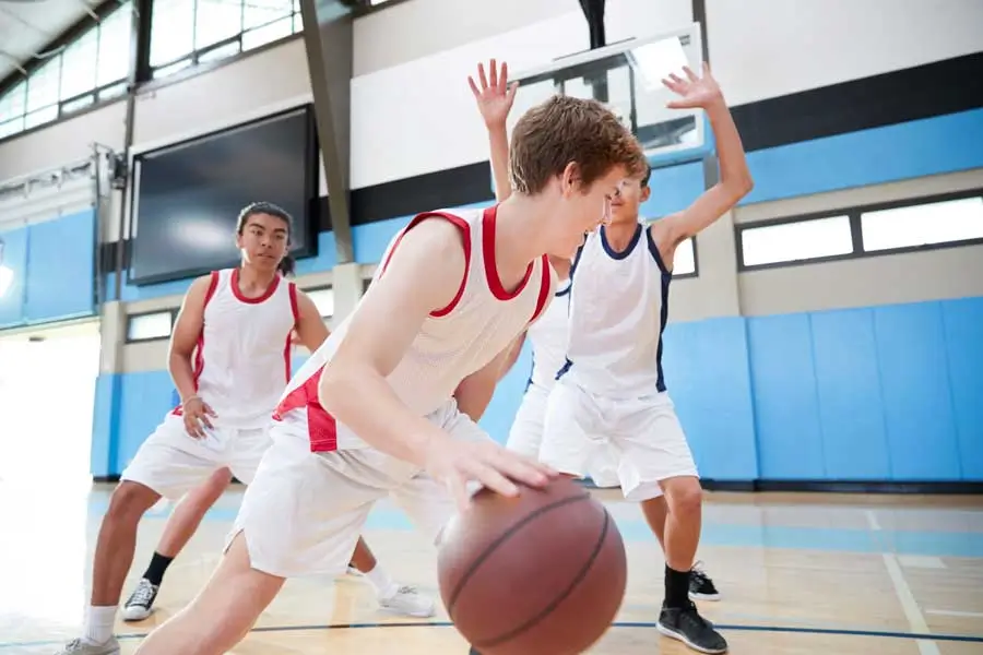 Basketball team practising on court