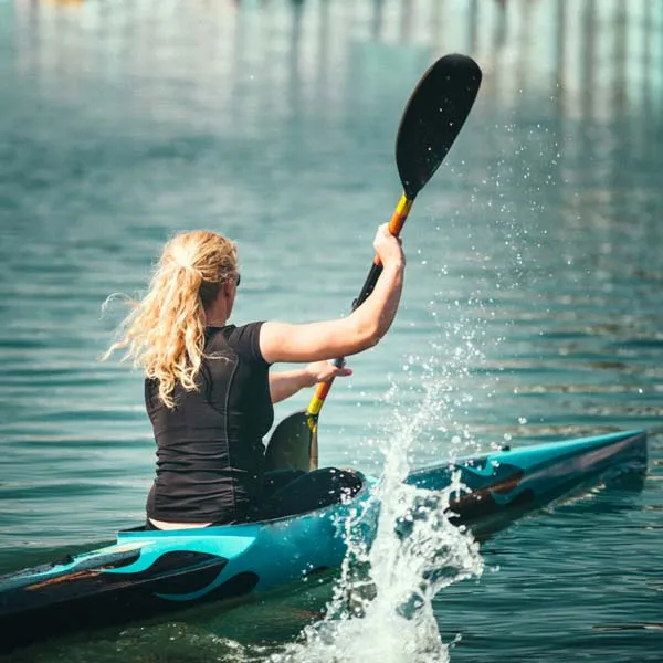 Canoe paddler training on calm water