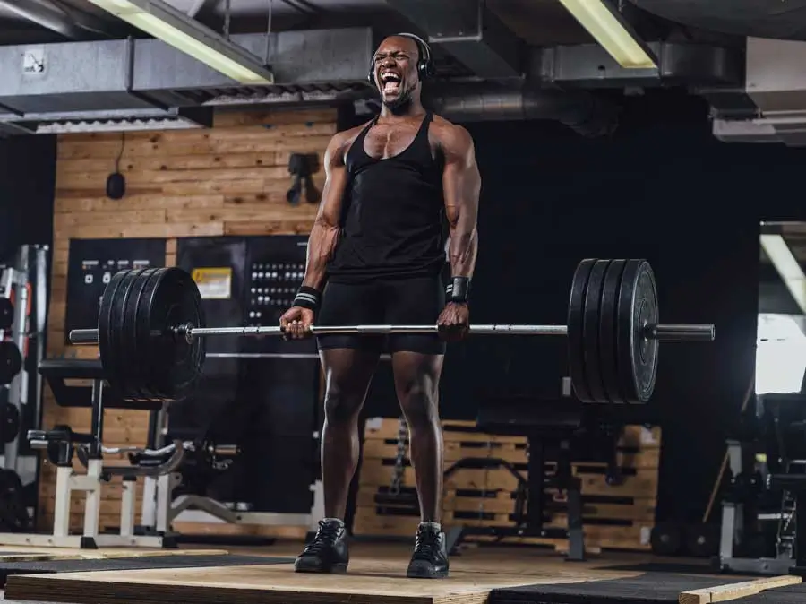 Athlete lifting weights in a gym