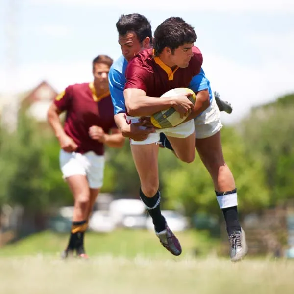 Rugby players competing on the field