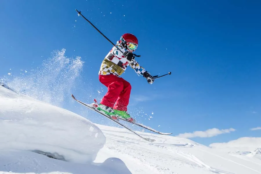 Boy on the slope skiing in Obersaxen Switzerland