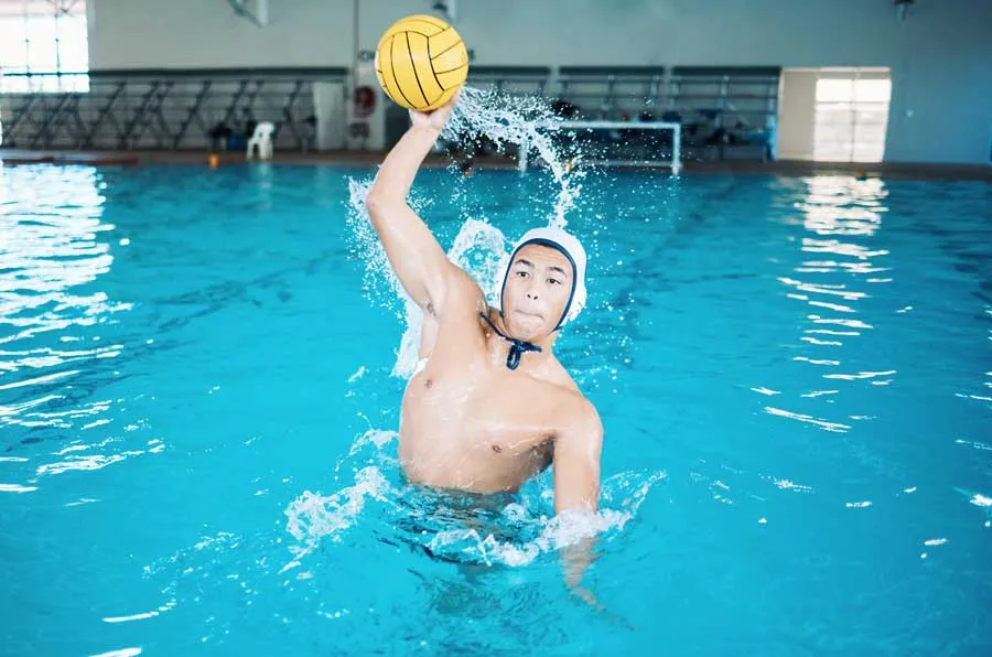 Water polo player training in a swimming pool